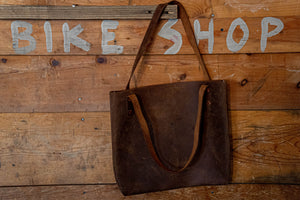 This chrome tote purse is photoed in local bike shop in Missoula, MT. If you are wanting the best leather goods products, shop Snowday leather