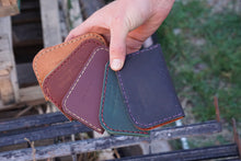 Load image into Gallery viewer, Hand stitched bifold made with 4 ounce full grain leather.  Fits up to 10 cards per pocket.  Natural color is vegetable tan.  All others are chrome tan.  4.5&quot; x 3&quot; folded. Custom Color and Stitching Leather Wallet. Snowday Leather | Missoula, MT
